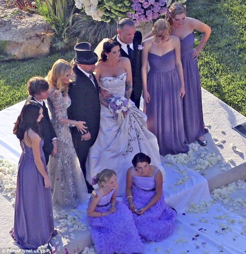 Alexis's bridesmaids wore strapless purple gowns with flower girls