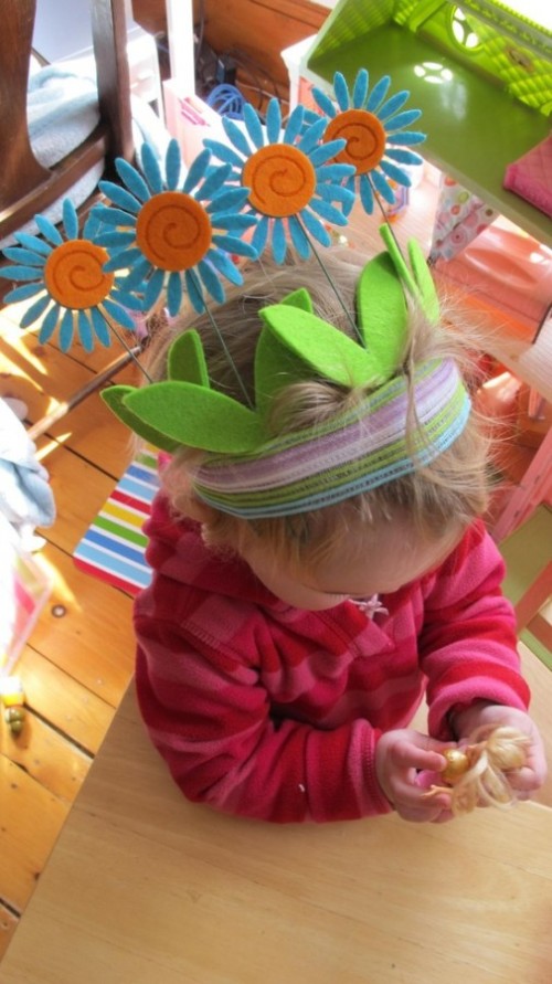 Easter flower hat baby girl in pink top, girl pink top, easter, holiday, green easter hat, flower hat, blue, orange